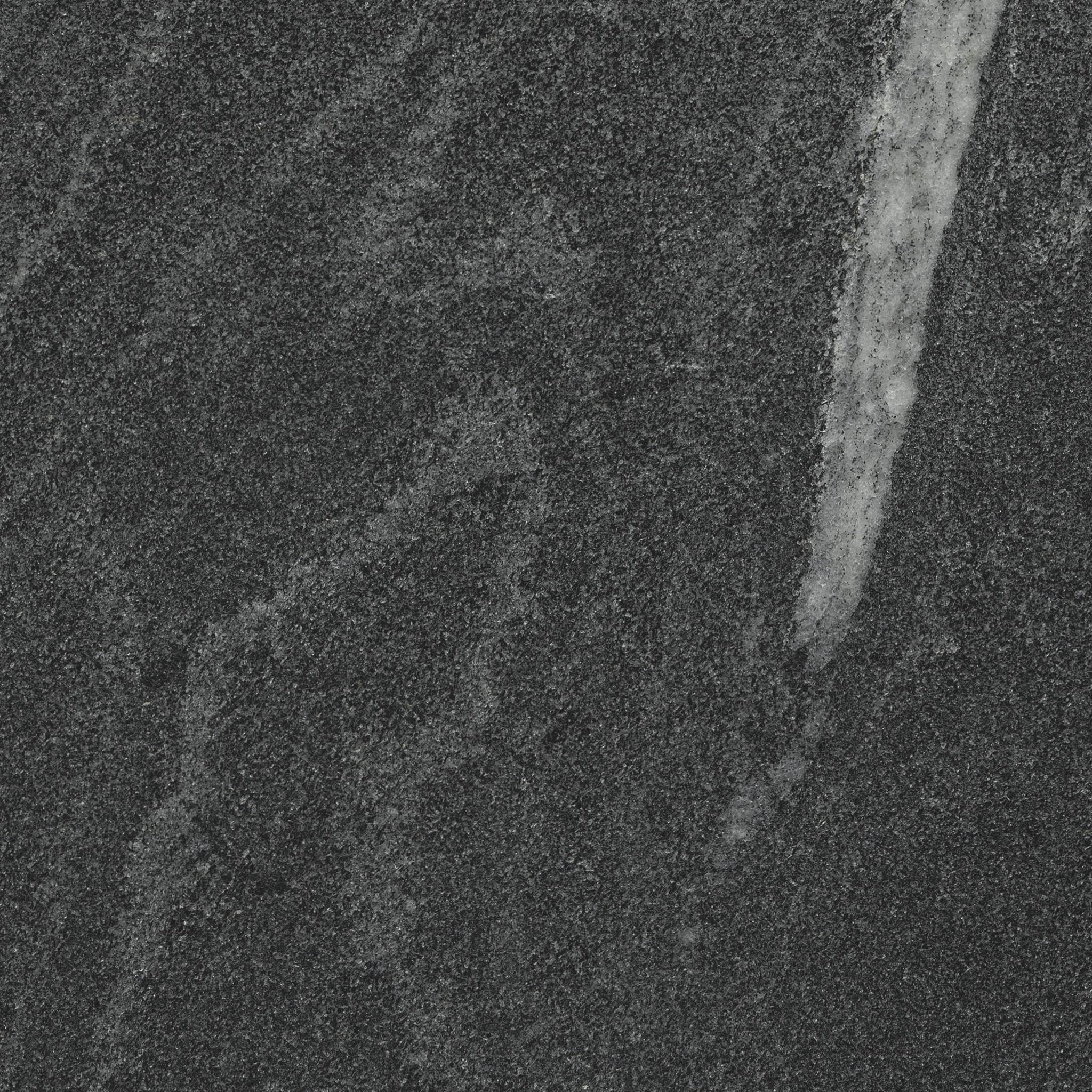 Downloadable high-resolution dark grey stone image, close-up detail of its fine granular texture and subtle light veining on a dark surface, for digital printing systems.